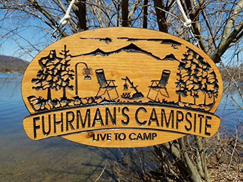 carved wooden camping sign